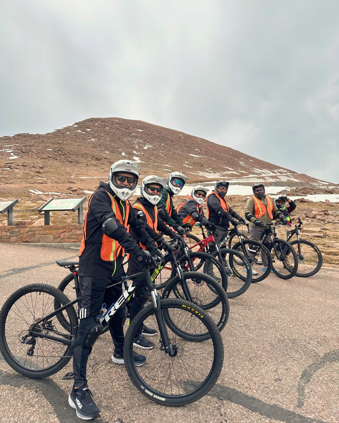 Tour group at Pikes Peak summit with Trek bikes CO Bike Tours